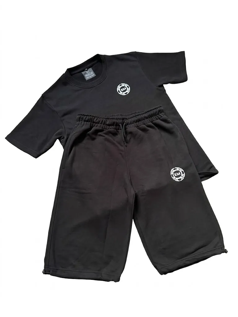 The Salah Set in black: terry tee and 3/4 shorts laid flat