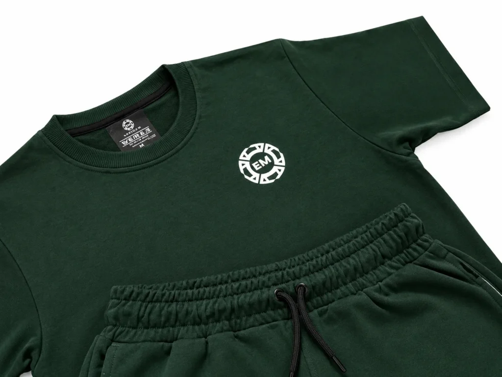 Close-up of the Evermore Club emblem on the forest green terry fabric
