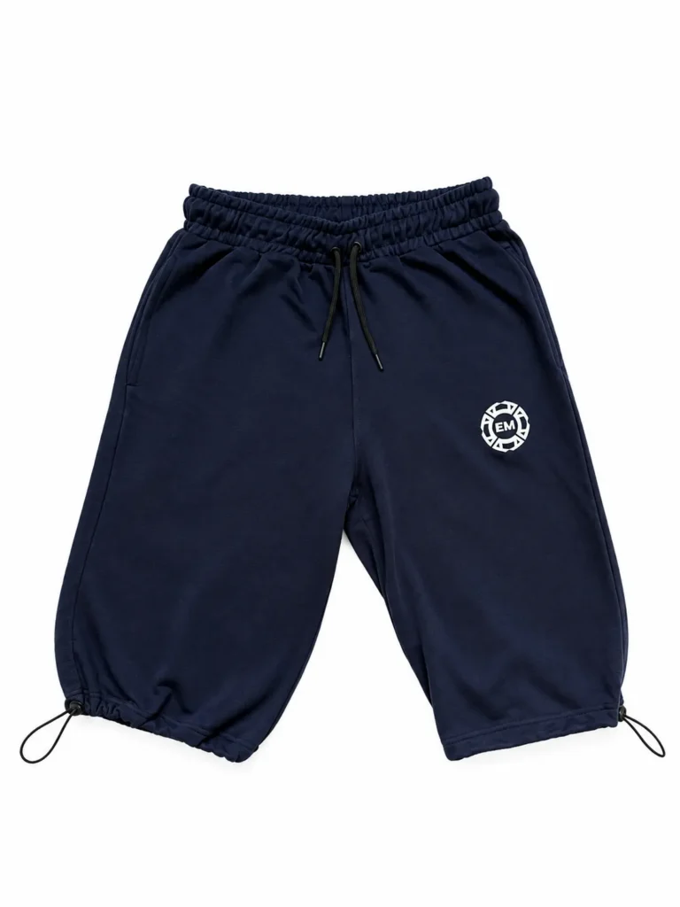 The navy blue Salah Set 3/4 shorts with the hem toggles pulled in